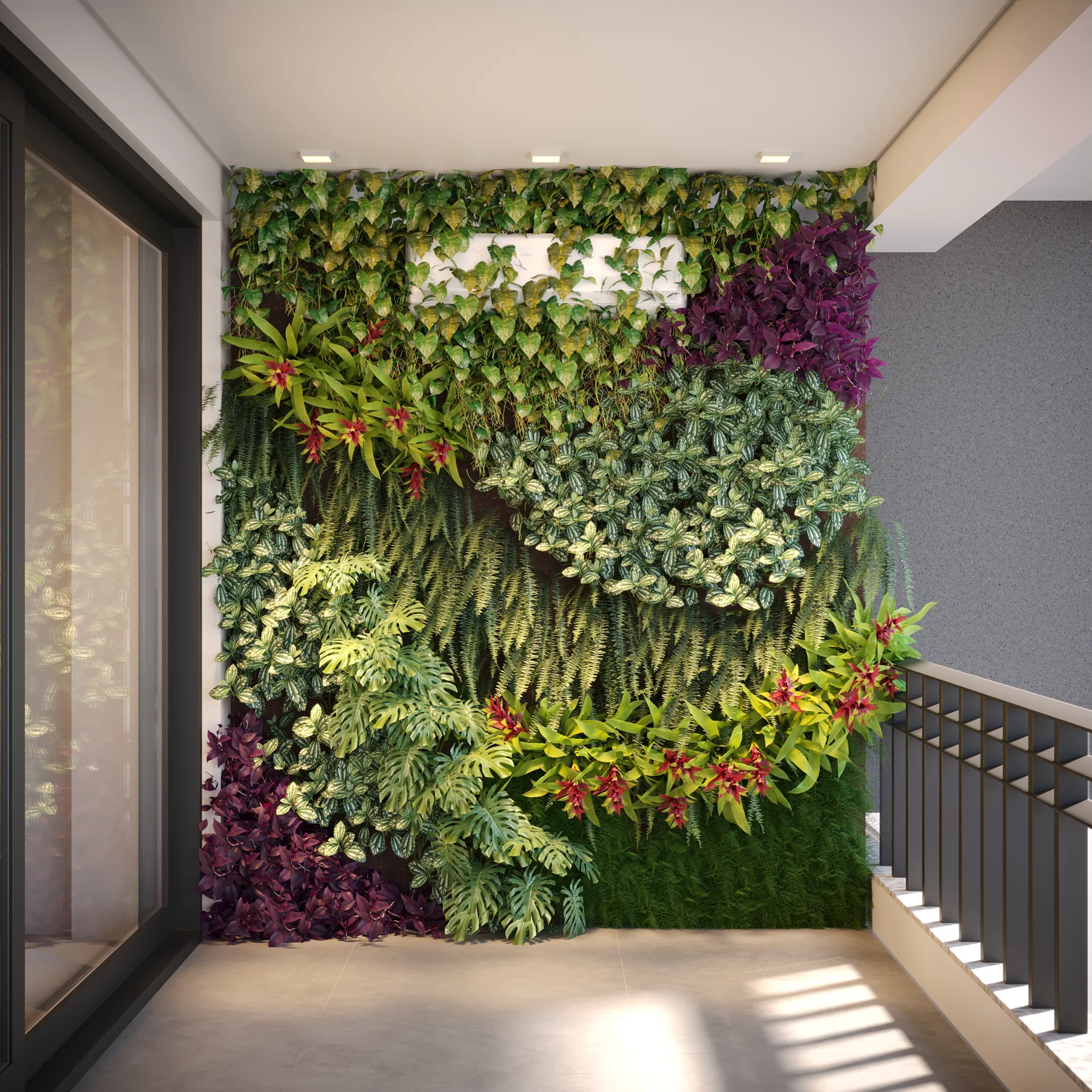 Jardim vertical de folhagens tropicais e brómelias vermelhas cobrindo um hall interno junto à escada e a uma porta de vidro alta