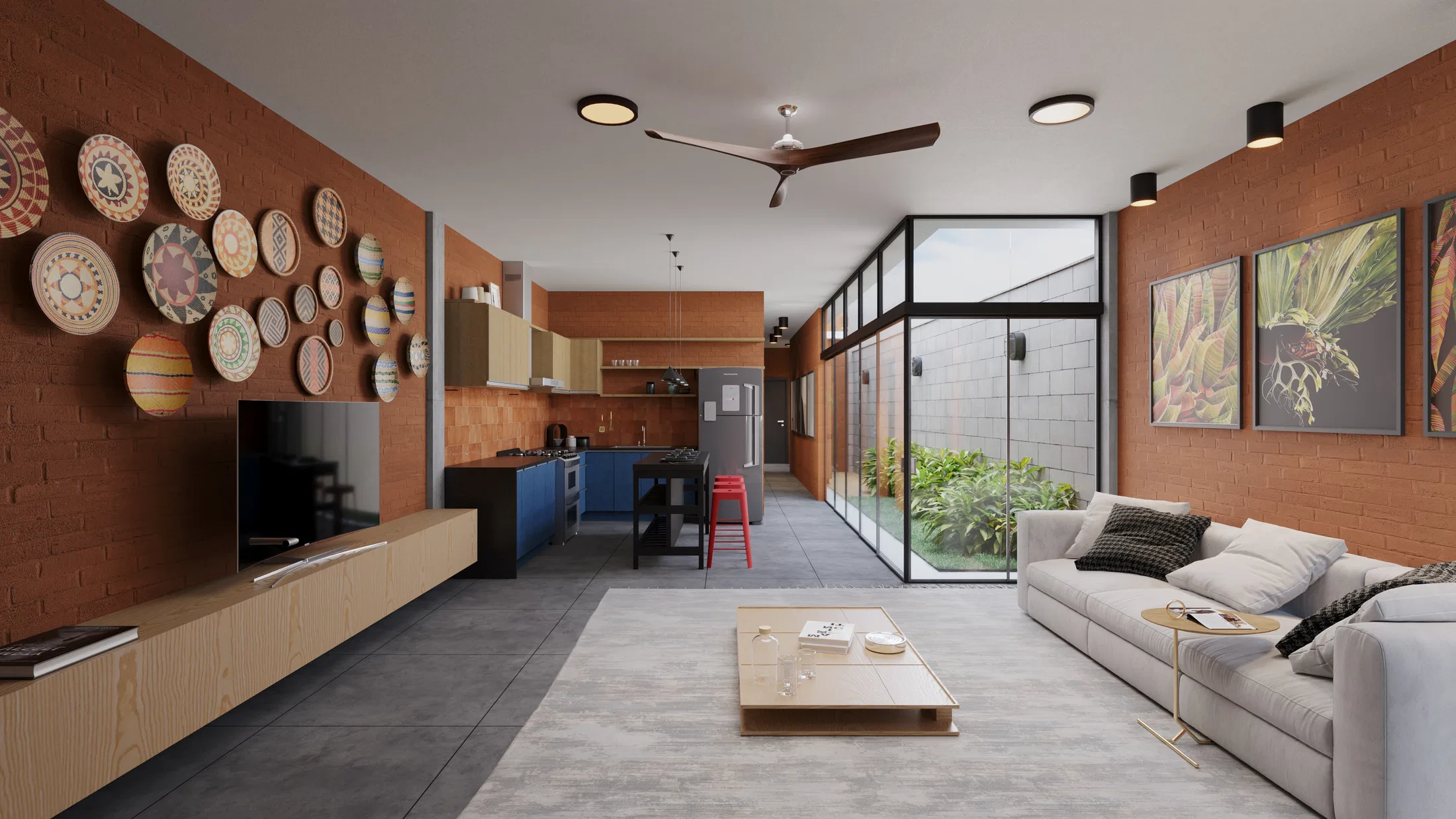 Living integrado à cozinha com parede de tijolo e coleção de pratos decorativos, sofá cinza, mesa de centro baixa e pátio envidraçado ao fundo