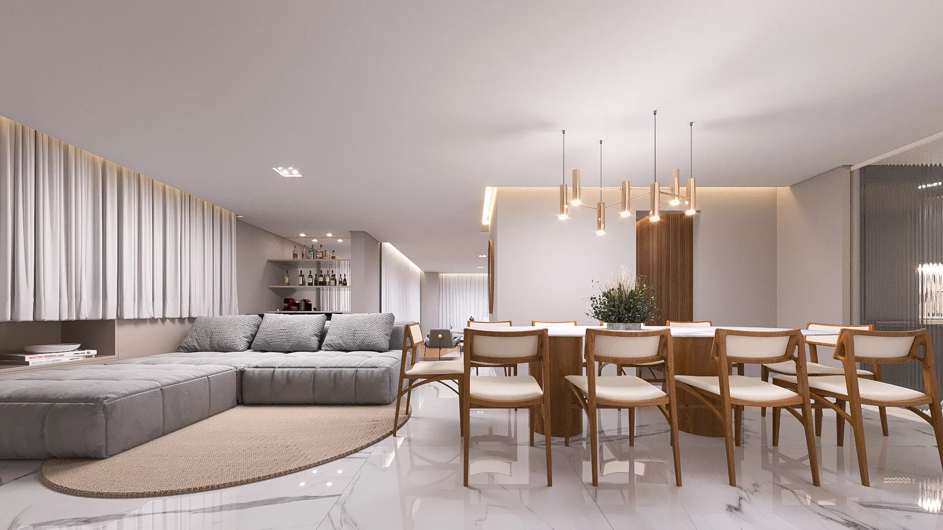 Living e sala de jantar integrados, com sofá modular cinza sobre tapete redondo e mesa de madeira com pendentes de latão