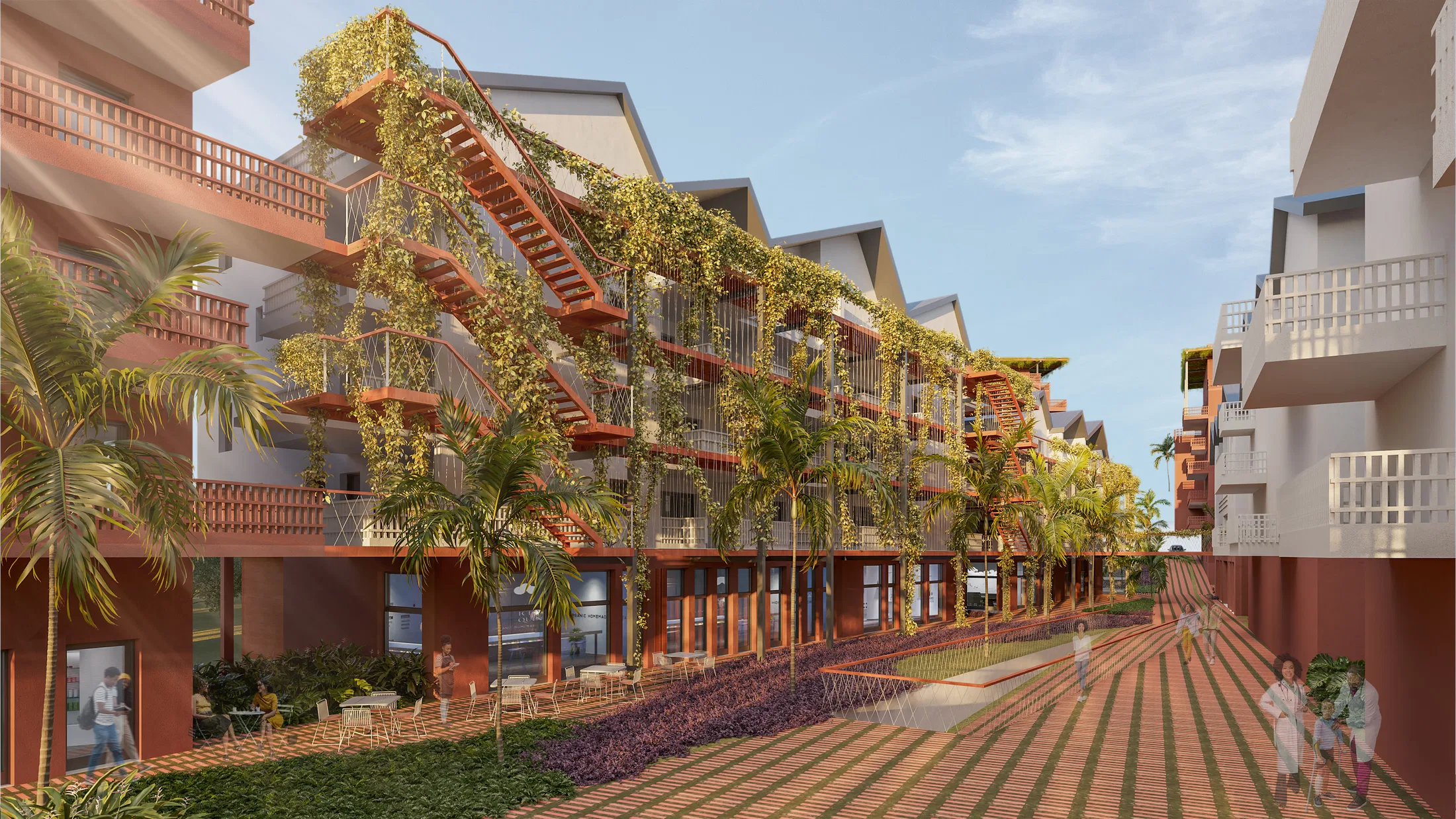 Fachada de edifício residencial em terracota coberta por trepadeiras, com escada externa e varandas em estrutura metálica