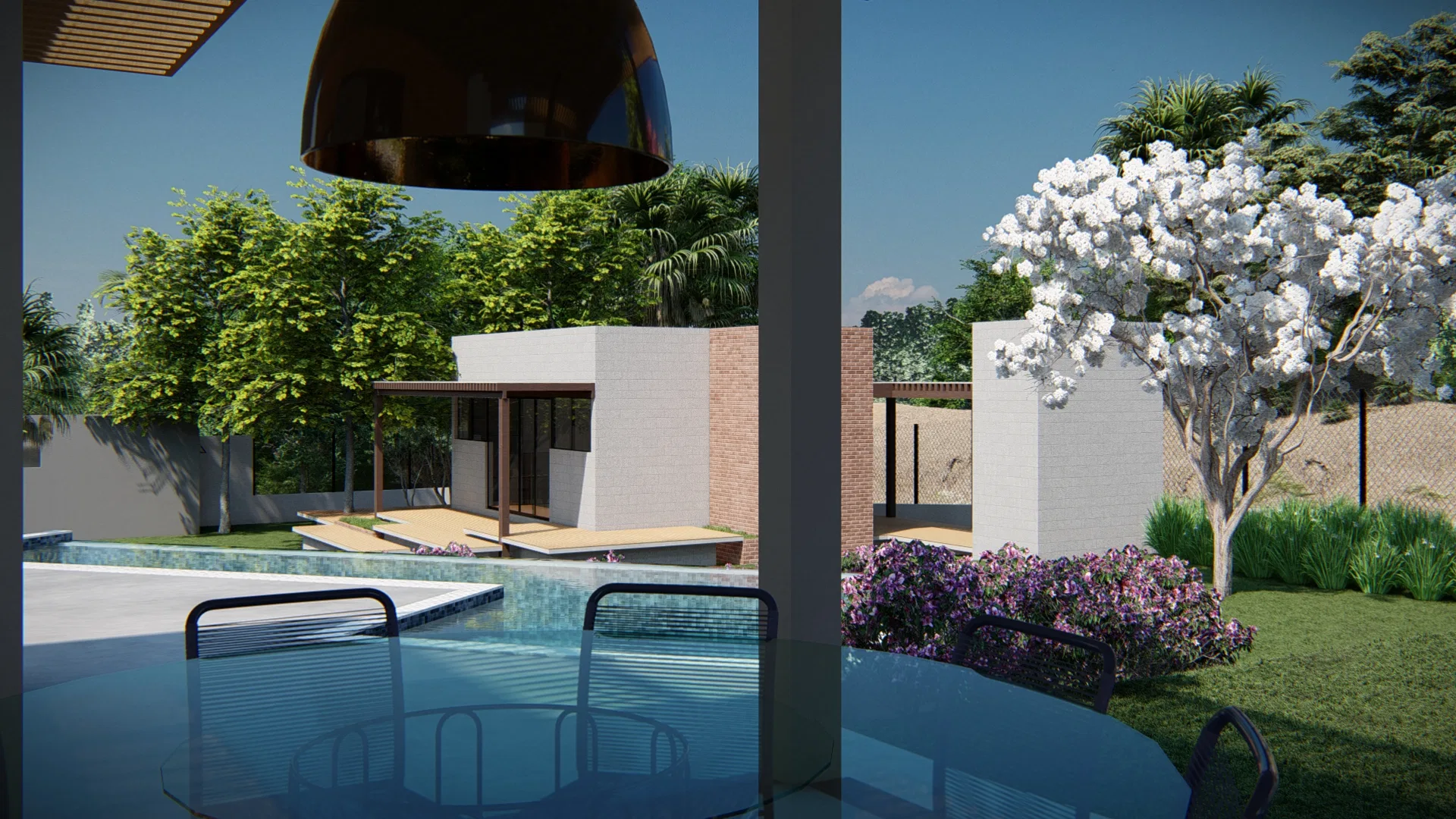 Área de estar coberta com pergolado de madeira e luminária pendente em cobre, vista para piscina de borda infinita e árvore florida ao fundo do jardim