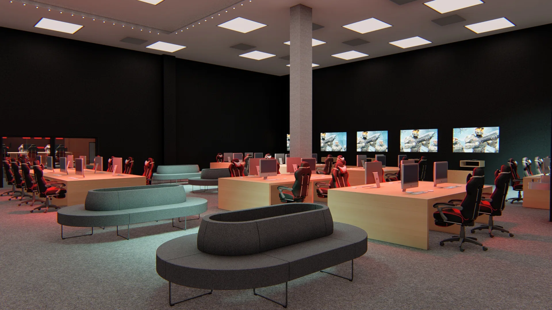 Lounge de games com estações individuais sobre bancadas de madeira, cadeiras gamer em vermelho e preto, bancos modulares curvos e telas acesas.