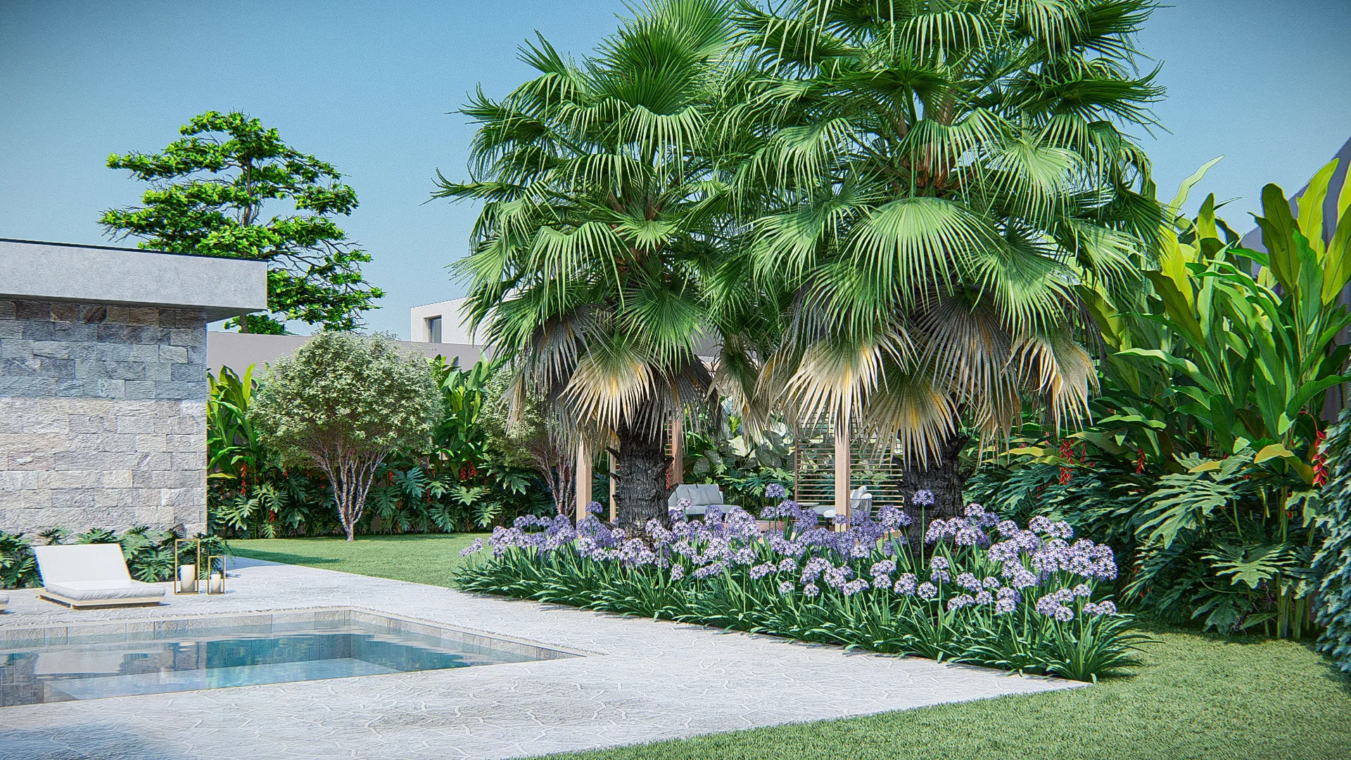 Jardim de piscina com palmeiras-leque, canteiro florido de agapantos e espreguiçadeira branca junto ao muro revestido de pedra.